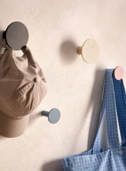 Matching circular wall-mounted hooks