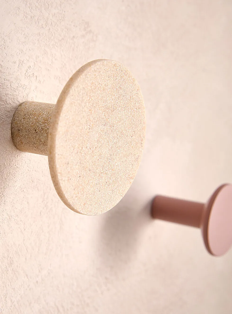 Matching circular wall-mounted hooks