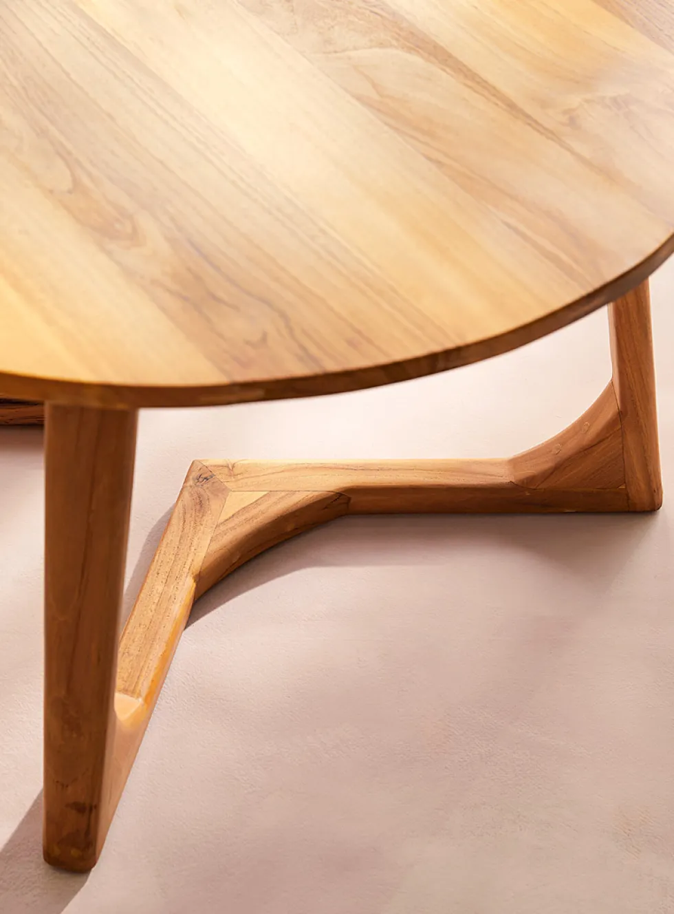 Minimalist rounded teakwood coffee table