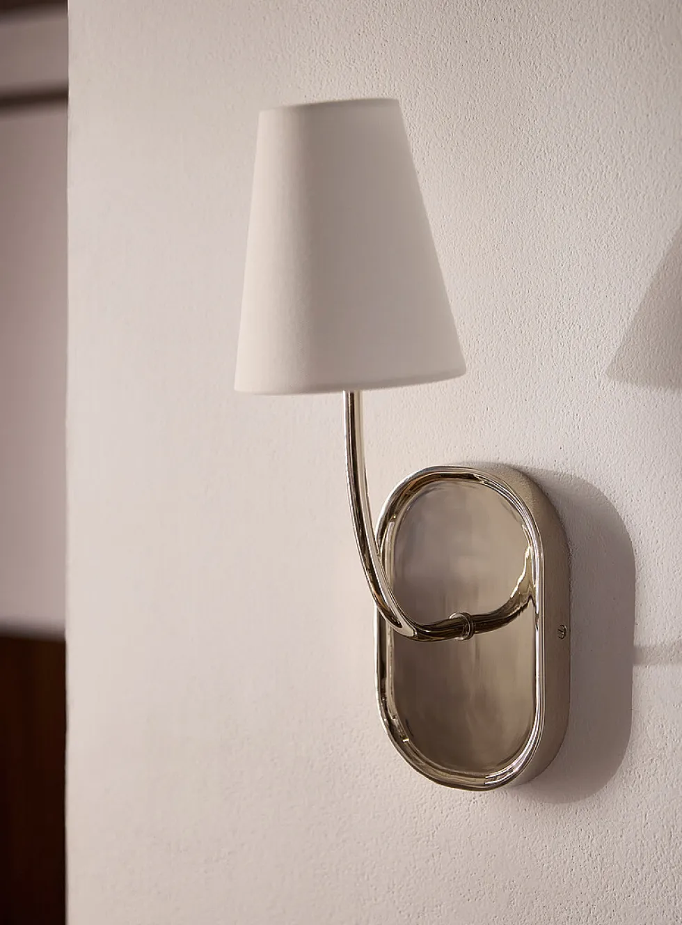 Nickel finish wall sconce