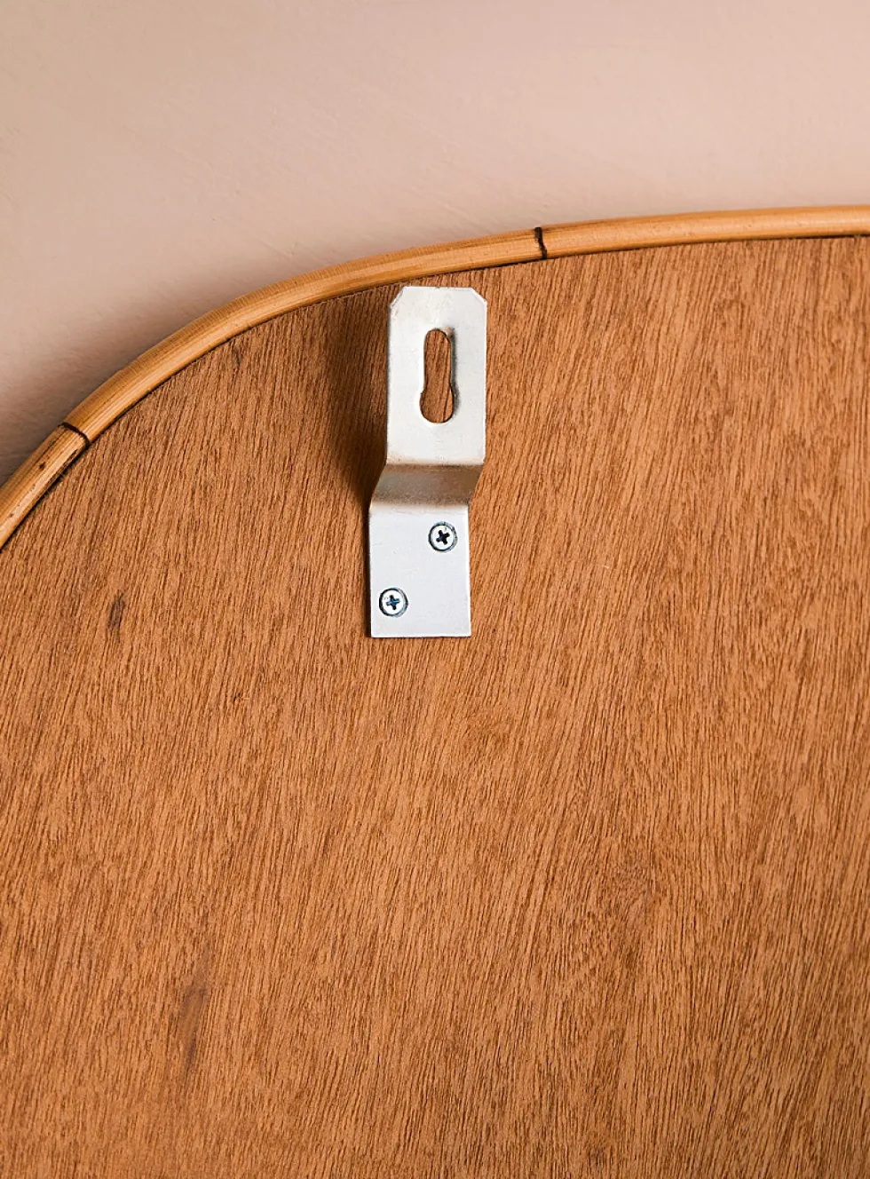 Rattan trim asymmetrical mirror