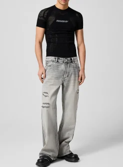 Raw edging mended flared-leg jean
