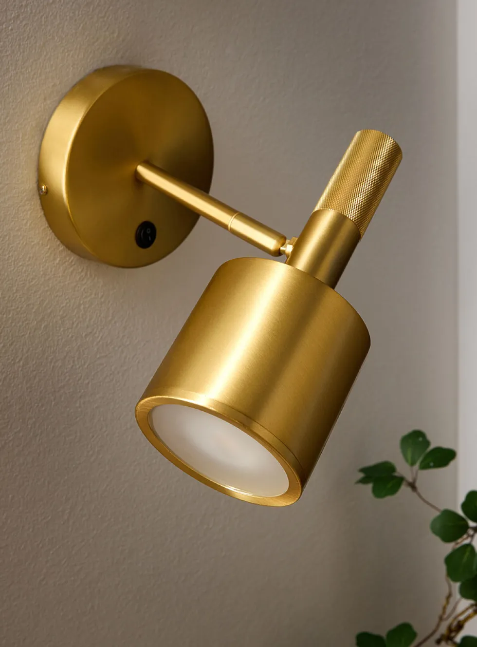 Rhoswen sleek brass finish wall sconce