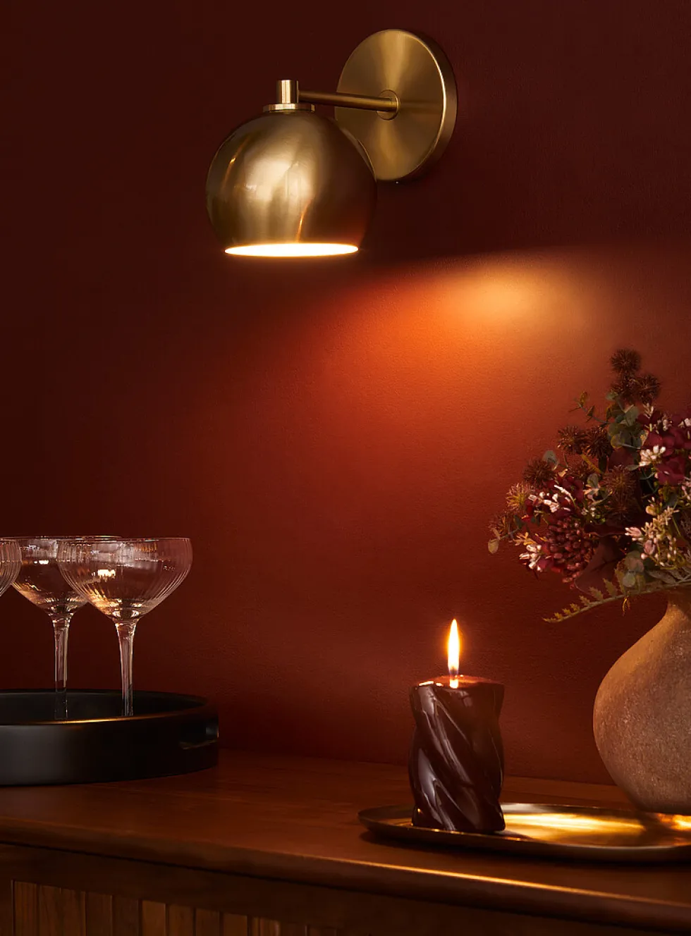 Sleek spehrical shade wall sconce