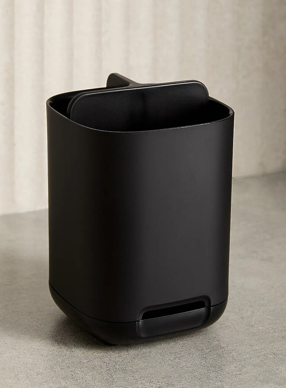 Small black toothbrush holder