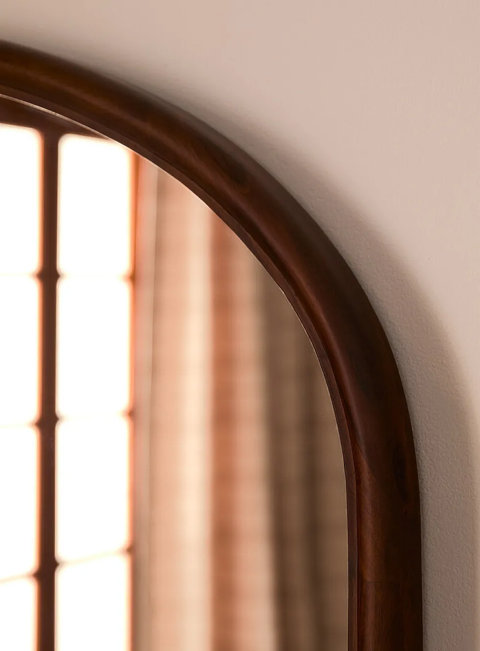 Walnut-finished arched frame mirror
